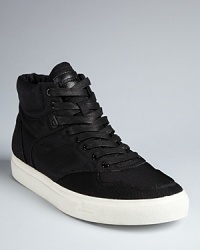 Always hip, Diesel delivers another solid design with these comfortable and relaxed sneakers for your wear-anywhere style. Always hip, Diesel delivers another solid design with these comfortable and relaxed sneakers for your wear-anywhere style.