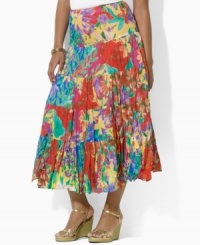 Airy, crinkled cotton lends casual elegance to Lauren by Ralph Lauren's flowing plus size maxi skirt, constructed in a tiered silhouette with a vibrant floral print for exotic glamour. Airy, crinkled cotton lends casual elegance to Lauren by Ralph Lauren's flowing plus size maxi skirt, constructed in a tiered silhouette with a vibrant floral print for exotic glamour.