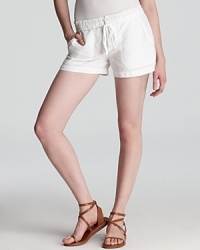The summer essentials: Vince white linen shorts--easy, go-anywhere style in a relaxed, versatile silhouette. The summer essentials: Vince white linen shorts--easy, go-anywhere style in a relaxed, versatile silhouette.