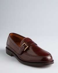 Put your best foot forward with this pair of classic loafers, featuring rich, sumptuous leather and a brass-tone side buckle for unique appeal. Put your best foot forward with this pair of classic loafers, featuring rich, sumptuous leather and a brass-tone side buckle for unique appeal.
