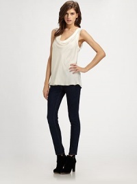 Elegant silk cowlneck with ribbed trim and a silhouette that hits below the hips. CowlneckSleevelessRibbed trimLonger length hits below the hipsSilkDry cleanImported Elegant silk cowlneck with ribbed trim and a silhouette that hits below the hips. CowlneckSleevelessRibbed trimLonger length hits below the hipsSilkDry cleanImported