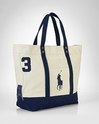 A sporty reincarnation of the iconic polo shirt, this twill cotton tote is adorned with an applied 3 and Ralph Lauren's Big Pony. A sporty reincarnation of the iconic polo shirt, this twill cotton tote is adorned with an applied 3 and Ralph Lauren's Big Pony.
