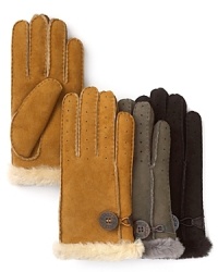Staying warm starts with UGG® Australia's plush, shearling-lined gloves-this pair features perforated suede and a logo button toggle. Staying warm starts with UGG® Australia's plush, shearling-lined gloves-this pair features perforated suede and a logo button toggle.