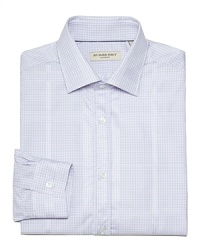 A well-dressed man can never have too many dress shirts. This Burberry shirt in a crisp cotton features a small check print and merges comfort and style with the perfect regular fit. A well-dressed man can never have too many dress shirts. This Burberry shirt in a crisp cotton features a small check print and merges comfort and style with the perfect regular fit.