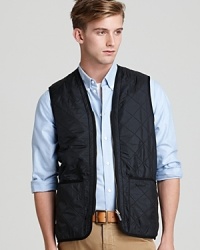 Invest in a trend-right quilted layer to maximize your seasonal style with this sleek zip-front Barbour vest. Zip out liner can be removed for warmer days. Invest in a trend-right quilted layer to maximize your seasonal style with this sleek zip-front Barbour vest. Zip out liner can be removed for warmer days.