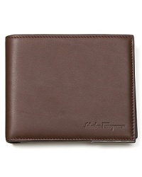 Offering classic practicality with a streamlined look, this handsome wallet from Salvatore Ferragamo has a sleek exterior and fully loaded interior with dedicated compartments for cards, cash and coins. Offering classic practicality with a streamlined look, this handsome wallet from Salvatore Ferragamo has a sleek exterior and fully loaded interior with dedicated compartments for cards, cash and coins.