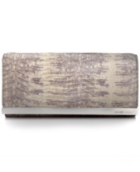Organization with elegance. Chic croc-embossed leather and gleaming signature hardware offer instant appeal to this MICHAEL Michael Kors clutch that discretely conceals a slim shoulder strap along with plenty of compartments for cash, cards, ID and lipstick. Organization with elegance. Chic croc-embossed leather and gleaming signature hardware offer instant appeal to this MICHAEL Michael Kors clutch that discretely conceals a slim shoulder strap along with plenty of compartments for cash, cards, ID and lipstick.