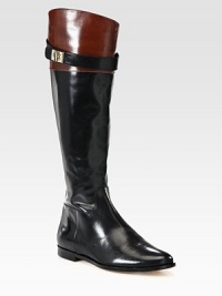 Lustrous leather in a trend-forward riding boot silhouette with a wrap-around buckle, side zipper and padded insole. Stacked heel, 1 (25mm)Shaft, 16½Leg circumference, 14½Leather upperSide zipperLeather lining and solePadded insoleImported