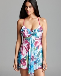 In Bloom's chemise features an impressionistic floral print floating on lighter-than-air fabric, with a racy, lacy racerback. In Bloom's chemise features an impressionistic floral print floating on lighter-than-air fabric, with a racy, lacy racerback.