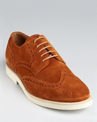 A relaxed but refined wingtip oxford rendered in soft suede. A relaxed but refined wingtip oxford rendered in soft suede.