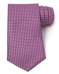 Rich color and lavish silk elevate your professional look to luxurious refinement in this handsome tie from Salvatore Ferragamo. Rich color and lavish silk elevate your professional look to luxurious refinement in this handsome tie from Salvatore Ferragamo.