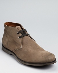 Crafted in fine Italian leather, this chukka cuts a lean profile. John Varvatos' touch is evident in details like subtle topstitching and weather and a sneaker-inspired contrast rubber sole. Crafted in fine Italian leather, this chukka cuts a lean profile. John Varvatos' touch is evident in details like subtle topstitching and weather and a sneaker-inspired contrast rubber sole.