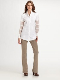 Crisp poplin, tailored with a sharp stand collar and enhanced by sheer sleeve panels.Stand collarButton frontLong partially sheer sleeves with button cuffsAbout 25 from shoulder to hem 61% cotton/39% silkDry cleanMade in Italy of imported fabricModel shown is 5'11 (180cm) wearing US size Small. Crisp poplin, tailored with a sharp stand collar and enhanced by sheer sleeve panels.Stand collarButton frontLong partially sheer sleeves with button cuffsAbout 25 from shoulder to hem 61% cotton/39% silkDry cleanMade in Italy of imported fabricModel shown is 5'11 (180cm) wearing US size Small.