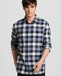 A tonal gingham pattern highlights this slim-fitting button-down, the perfect complement for a pair of distressed jeans or dress it up with bright white trousers. A tonal gingham pattern highlights this slim-fitting button-down, the perfect complement for a pair of distressed jeans or dress it up with bright white trousers.