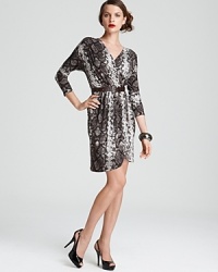 Ushering in this season's flair for the exotic, this MICHAEL Michael Kors dress enlivens your 9-to-5 style with sleek snake-skin print. Set off the tonal palette with flashes of silver for untamed glamour. Ushering in this season's flair for the exotic, this MICHAEL Michael Kors dress enlivens your 9-to-5 style with sleek snake-skin print. Set off the tonal palette with flashes of silver for untamed glamour.