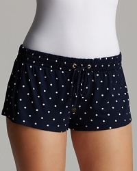 Soft sleep shorts with a drawstring waist and signature heart charm accent, a pretty polka dot look from Juicy Couture. Soft sleep shorts with a drawstring waist and signature heart charm accent, a pretty polka dot look from Juicy Couture.