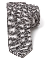 Crafted in a unique blend of wool and plush silk, this textured tie provides masculine polish and a modern narrow width. Crafted in a unique blend of wool and plush silk, this textured tie provides masculine polish and a modern narrow width.