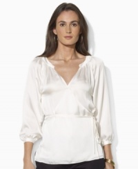 Decadent, rippling satin is luxuriously designed in a classic wrap silhouette with billowing sleeves to create a chic, contemporary essential from Lauren by Ralph Lauren. Decadent, rippling satin is luxuriously designed in a classic wrap silhouette with billowing sleeves to create a chic, contemporary essential from Lauren by Ralph Lauren.