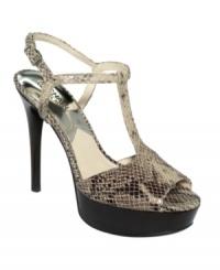 You'll want to keep this t-strap in heavy rotation. MICHAEL Michael Kors' Felicia platform sandals feature a fierce python print and a dramatic platform. You'll want to keep this t-strap in heavy rotation. MICHAEL Michael Kors' Felicia platform sandals feature a fierce python print and a dramatic platform.