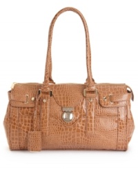 A glossy look fit for a socialite. This Ivanka Trump satchel features gleaming goldtone hardware, a signature charm and protective bottom feet. A glossy look fit for a socialite. This Ivanka Trump satchel features gleaming goldtone hardware, a signature charm and protective bottom feet.