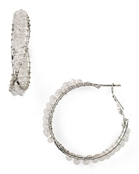 Give your wardrobe a hit of on-trend texture with this pair of twisted hoop earrings from RJ Graziano, accented by rough, wrapped crystals. Give your wardrobe a hit of on-trend texture with this pair of twisted hoop earrings from RJ Graziano, accented by rough, wrapped crystals.
