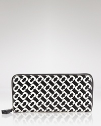 Compact style goes bold with this printed wallet from DIANE von FURSTENBERG. In the brand's signature graphics, this practical piece is almost too pretty to hide inside your purse. Compact style goes bold with this printed wallet from DIANE von FURSTENBERG. In the brand's signature graphics, this practical piece is almost too pretty to hide inside your purse.