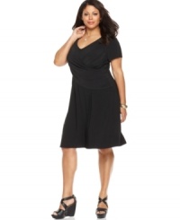 Look slender and sensational with Elementz' short sleeve plus size dress, featuring a flattering crisscross front and slimming panel-- wear it from day to play! Look slender and sensational with Elementz' short sleeve plus size dress, featuring a flattering crisscross front and slimming panel-- wear it from day to play!