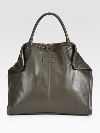 A roomy carryall with a sleek design in supple leather.Double top handles, 6 dropTop zip closureMagnetic fold-down cornersOne inside zip pocketCotton lining18W X 16H X 4½DMade in Italy A roomy carryall with a sleek design in supple leather.Double top handles, 6 dropTop zip closureMagnetic fold-down cornersOne inside zip pocketCotton lining18W X 16H X 4½DMade in Italy