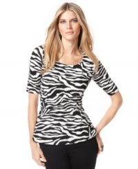 A black-and-white print updates the silhouette of the season, the peplum. INC's top puts a bold, graphic twist on the trend. A black-and-white print updates the silhouette of the season, the peplum. INC's top puts a bold, graphic twist on the trend.