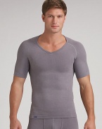 An essential underlayer or workout separate with an exclusive design that builds in physiotherapy taping techniques to gently pull the shoulders back and promote optimal alignment. Seamless stitching and targeted mesh provides a breathable, second skin fit. Micro polyester/nylon/spandex; machine wash Imported