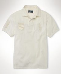 Updated with tonal heritage embroidery for the look of a vintage favorite, this trim-fitting rugby offers superior comfort and athletic style in lightweight cotton mesh. Updated with tonal heritage embroidery for the look of a vintage favorite, this trim-fitting rugby offers superior comfort and athletic style in lightweight cotton mesh.