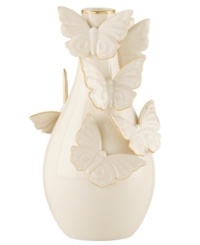 The essence of whimsy, this Lenox Flutter bud vase will lift your spirits with gold-tipped butterflies and elegant banding in timeless ivory porcelain. The essence of whimsy, this Lenox Flutter bud vase will lift your spirits with gold-tipped butterflies and elegant banding in timeless ivory porcelain.