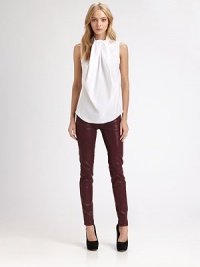 Expressively draped neckline, sleeveless silhouette and back button closures redefine this poplin shirt of pure cotton. Draped necklineSleevelessContour hemButtoned backCottonDry cleanImportedModel shown is 5'9 (176cm) wearing US size 4. Expressively draped neckline, sleeveless silhouette and back button closures redefine this poplin shirt of pure cotton. Draped necklineSleevelessContour hemButtoned backCottonDry cleanImportedModel shown is 5'9 (176cm) wearing US size 4.