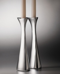 One of Nambe's most popular designs, the Tri-Corner candlesticks were designed by sculptor, Richard K. Thomas. These candlesticdks embody Nambe's guiding principles of design: objects for the home that are functional, as well as beautiful. An asymmetrical shape and high-polished metal combine to lend your home modern elegance. One of Nambe's most popular designs, the Tri-Corner candlesticks were designed by sculptor, Richard K. Thomas. These candlesticdks embody Nambe's guiding principles of design: objects for the home that are functional, as well as beautiful. An asymmetrical shape and high-polished metal combine to lend your home modern elegance.