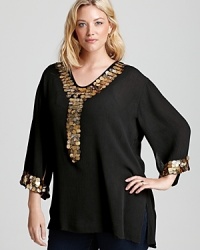 Set your style aflame in this T Bags Plus blouse finished with a dazzling sequin trim. Garnish with gold accents and shimmer with each step. Set your style aflame in this T Bags Plus blouse finished with a dazzling sequin trim. Garnish with gold accents and shimmer with each step.