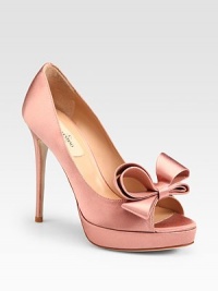 Shimmery and sweet-- this satin peep toe pump has a slight platform and signature bow adornment. Self-covered heel, 5 (125mm)Covered platform, 1 (25mm)Compares to a 4 heel (100mm)Satin upperPeep toeLeather lining and solePadded insoleMade in Italy Shimmery and sweet-- this satin peep toe pump has a slight platform and signature bow adornment. Self-covered heel, 5 (125mm)Covered platform, 1 (25mm)Compares to a 4 heel (100mm)Satin upperPeep toeLeather lining and solePadded insoleMade in Italy