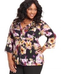 Flaunt feminine frills with NY Collection's three-quarter-sleeve plus size blouse, accented by a floral-print and ruffles. Flaunt feminine frills with NY Collection's three-quarter-sleeve plus size blouse, accented by a floral-print and ruffles.