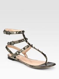 A go-to favorite in lustrous metallic leather with signature metal studs and adjustable ankle straps. Metallic leather upper with metal studsAdjustable ankle strapsLeather lining and solePadded insoleMade in Italy A go-to favorite in lustrous metallic leather with signature metal studs and adjustable ankle straps. Metallic leather upper with metal studsAdjustable ankle strapsLeather lining and solePadded insoleMade in Italy