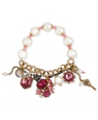 Betsey Johnson's half-stretch bracelet features gold tone bracelet chains, hematite tone crystal cup chain accent, glass pearl and pink faceted bead stretch chain, fuchsia-colored crystal gems, hematite and gold tone bubble hears and round crystal accent. Set in gold tone mixed metal. Approximate length: 7-1/2 inches. Betsey Johnson's half-stretch bracelet features gold tone bracelet chains, hematite tone crystal cup chain accent, glass pearl and pink faceted bead stretch chain, fuchsia-colored crystal gems, hematite and gold tone bubble hears and round crystal accent. Set in gold tone mixed metal. Approximate length: 7-1/2 inches.