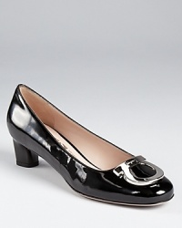 A classic shoe for the polished professional, these Ferragamo pumps offer a moderate heel--the perfect ingredient for all day wear. A classic shoe for the polished professional, these Ferragamo pumps offer a moderate heel--the perfect ingredient for all day wear.
