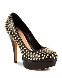 Covered in spiky, gold-tone studs, VINCE CAMUTO's punky Madelyn platforms get to the point in pebbled leather. Covered in spiky, gold-tone studs, VINCE CAMUTO's punky Madelyn platforms get to the point in pebbled leather.