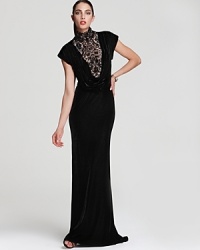 Tadashi Shoji's plush velvet gown exudes drama with a high neckline and lace accents. Team with dark red lips to complete the vampy look. Tadashi Shoji's plush velvet gown exudes drama with a high neckline and lace accents. Team with dark red lips to complete the vampy look.