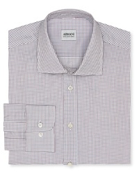 This refreshingly colorful take on a classic windowpane check shirt offers a contemporary fit in superior Italian cotton for a truly refined masterpiece from Armani Collezioni. This refreshingly colorful take on a classic windowpane check shirt offers a contemporary fit in superior Italian cotton for a truly refined masterpiece from Armani Collezioni.