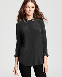 A beaded collar lends the perfect dash of shine to this Equipment blouse, transitioning the look from day to night with ease. A beaded collar lends the perfect dash of shine to this Equipment blouse, transitioning the look from day to night with ease.