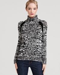 Made from extra-fine Merino wool, this printed Theory sweater lends modern edge to this timeless turtleneck silhouette. Made from extra-fine Merino wool, this printed Theory sweater lends modern edge to this timeless turtleneck silhouette.