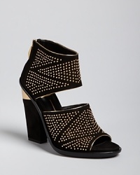 Dolce Vita takes basic go-to sandals to stellar style heights with all-over mini studs starring against a midnight black suede backdrop. Dolce Vita takes basic go-to sandals to stellar style heights with all-over mini studs starring against a midnight black suede backdrop.