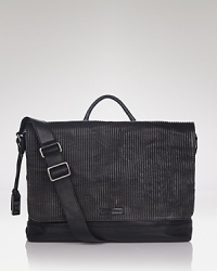 The carefully striated front flap calls attention to this rugged but refined bag from Frye, a composed design in exceptional leather crafted for both form and function. The carefully striated front flap calls attention to this rugged but refined bag from Frye, a composed design in exceptional leather crafted for both form and function.