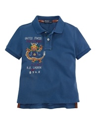 An array of embroidery and screen-printed details give a modern update to a classic polo shirt. An array of embroidery and screen-printed details give a modern update to a classic polo shirt.