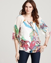 Painterly prints float across this Shiloh 770 blouse for a bold take on bohemian-chic. Team with sleek skinnies to highlight the vibrant hues. Painterly prints float across this Shiloh 770 blouse for a bold take on bohemian-chic. Team with sleek skinnies to highlight the vibrant hues.