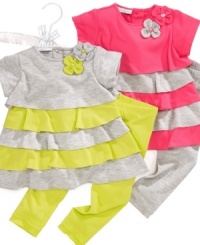 Vibrant colors and playful ruffles give this First Impressions tunic and leggings set a fun style. Vibrant colors and playful ruffles give this First Impressions tunic and leggings set a fun style.